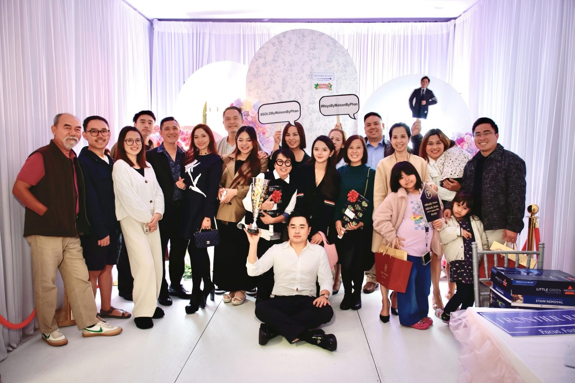 Paul Phan with clients and family celebrating the 2025 Top Producer recognition at Frontier Realty